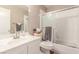 Bathroom with white tile, single sink vanity, and sliding glass door shower at 3323 Bay Horse Ct, North Las Vegas, NV 89032