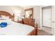 Bedroom features wood flooring, side table, and neutral paint at 3323 Bay Horse Ct, North Las Vegas, NV 89032