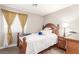 Bedroom features wood flooring, side table, and neutral paint at 3323 Bay Horse Ct, North Las Vegas, NV 89032
