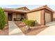 Charming home featuring a two-car garage, a well-manicured lawn, and desert landscaping at 3323 Bay Horse Ct, North Las Vegas, NV 89032