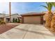 Inviting single-story home showcasing desert-friendly landscaping and a two-car garage at 3323 Bay Horse Ct, North Las Vegas, NV 89032
