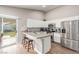 Bright kitchen featuring white cabinets, granite countertops, and stainless steel appliances at 3323 Bay Horse Ct, North Las Vegas, NV 89032