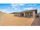 Spacious backyard area featuring block wall fencing and covered patio, ideal for outdoor living at 346 Tigullio Ave, Henderson, NV 89011