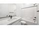 Modern bathroom with sleek white vanity and shower over tub at 346 Tigullio Ave, Henderson, NV 89011