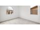Bright bedroom with neutral carpet and a window showcasing the outside view at 346 Tigullio Ave, Henderson, NV 89011
