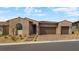 Charming single-story home with a three-car garage and desert landscaping at 346 Tigullio Ave, Henderson, NV 89011