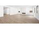 Open living area with neutral walls, modern fireplace, and hardwood floors at 346 Tigullio Ave, Henderson, NV 89011