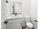 Modern powder room with floating vanity, mirror, and toilet at 346 Tigullio Ave, Henderson, NV 89011