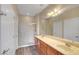 Bright bathroom featuring double sinks, modern fixtures, and a shower at 3544 Tack St, Las Vegas, NV 89122