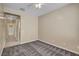Bedroom featuring carpet flooring, tan walls and view to bath area at 3544 Tack St, Las Vegas, NV 89122