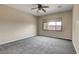 Neutral bedroom with carpeting and a large window for natural light at 3544 Tack St, Las Vegas, NV 89122