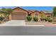 Charming single-story home featuring a desert landscape, a two-car garage, and a welcoming facade at 3544 Tack St, Las Vegas, NV 89122