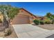 Charming single-story home featuring a two-car garage and desert landscaping at 3544 Tack St, Las Vegas, NV 89122