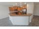 Open concept kitchen featuring granite countertops and stainless steel appliances at 3544 Tack St, Las Vegas, NV 89122