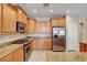 Modern kitchen with stainless steel appliances and wooden cabinetry at 3544 Tack St, Las Vegas, NV 89122