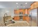 Kitchen features granite countertops, stainless steel appliances, and bright lighting at 3544 Tack St, Las Vegas, NV 89122