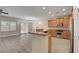 Open kitchen layout with granite breakfast bar and stainless appliances at 3544 Tack St, Las Vegas, NV 89122