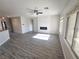 Bright living room with sleek flooring, a modern fireplace, and plenty of natural light at 3544 Tack St, Las Vegas, NV 89122