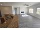 Open concept living room features a modern fireplace and large windows at 3544 Tack St, Las Vegas, NV 89122