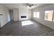 Bright living room with sleek flooring, a modern fireplace, and plenty of natural light at 3544 Tack St, Las Vegas, NV 89122