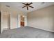 Spacious main bedroom featuring neutral walls, carpet, and a ceiling fan at 3544 Tack St, Las Vegas, NV 89122