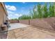 Spacious backyard with brick pavers, concrete patio, and desert landscaping at 3752 Calle De Rio Ave, Las Vegas, NV 89115