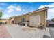 View of home backyard featuring a concrete patio and door with ornate security bars at 3752 Calle De Rio Ave, Las Vegas, NV 89115