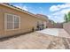 Home backyard with brick pavers, concrete patio, and desert landscaping at 3752 Calle De Rio Ave, Las Vegas, NV 89115