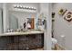 Bathroom featuring double sinks, decorative accents, and storage at 3752 Calle De Rio Ave, Las Vegas, NV 89115