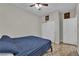 Comfortable bedroom with tile flooring, closet, and an additional door at 3752 Calle De Rio Ave, Las Vegas, NV 89115