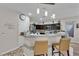 Open kitchen with breakfast bar and modern dark wood cabinetry at 3752 Calle De Rio Ave, Las Vegas, NV 89115