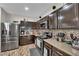 Bright kitchen featuring stainless steel appliances and tiled backsplash at 3752 Calle De Rio Ave, Las Vegas, NV 89115