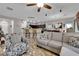Open-plan living area showcasing tile floors and contemporary decor with comfortable seating and a view of the kitchen at 3752 Calle De Rio Ave, Las Vegas, NV 89115