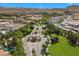 Exclusive gated community featuring lush landscaping, elegant homes, and mountain views at 42 Ravenswood Ave, Las Vegas, NV 89141