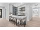 Sleek bar area with stylish seating and sophisticated wine display at 42 Ravenswood Ave, Las Vegas, NV 89141