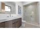 Modern bathroom with a glass enclosed shower, sleek vanity with white counter, and modern fixtures at 42 Ravenswood Ave, Las Vegas, NV 89141