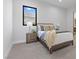 Bright bedroom with a comfortable bed, stylish decor, and a large window offering natural light and views at 42 Ravenswood Ave, Las Vegas, NV 89141