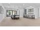 Spacious dining area featuring modern lighting and backyard views at 42 Ravenswood Ave, Las Vegas, NV 89141