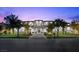 Elegant two-story home featuring manicured landscaping and a symmetrical facade at 42 Ravenswood Ave, Las Vegas, NV 89141