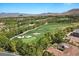 Scenic aerial view of the lush green golf course surrounded by mature trees and luxury homes at 42 Ravenswood Ave, Las Vegas, NV 89141