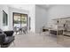 Bright home office with large windows, stylish desk, and shelving, creating an ideal workspace with natural light at 42 Ravenswood Ave, Las Vegas, NV 89141