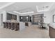 Bright open-concept kitchen with bar seating, modern appliances, and an adjacent dining area at 42 Ravenswood Ave, Las Vegas, NV 89141
