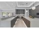 Gourmet kitchen with stainless steel appliances, a spacious island, and ample counter space for cooking at 42 Ravenswood Ave, Las Vegas, NV 89141