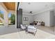 The main bedroom's open layout connects to a covered patio with seating, creating a seamless indoor-outdoor living space at 42 Ravenswood Ave, Las Vegas, NV 89141
