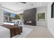 The main bedroom includes a fireplace and a window looking out to the swimming pool and backyard at 42 Ravenswood Ave, Las Vegas, NV 89141