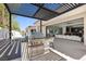 This outdoor kitchen has stainless steel appliances and bar stool seating at 42 Ravenswood Ave, Las Vegas, NV 89141