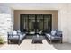 Relaxing patio area with modern furniture and tranquil backyard views at 42 Ravenswood Ave, Las Vegas, NV 89141