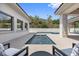 Modern pool with spa and an outdoor seating area for entertaining guests at 42 Ravenswood Ave, Las Vegas, NV 89141