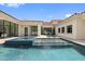 Luxury home featuring a stunning outdoor pool and spa with modern architecture and sleek design at 42 Ravenswood Ave, Las Vegas, NV 89141