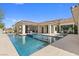 Resort-style pool with spa surrounded by a patio and landscaped yard at 42 Ravenswood Ave, Las Vegas, NV 89141